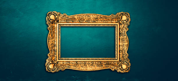 istock Vintage luxury golden frame with ornate baroque decoration on rustic textured wall background. 1629045395