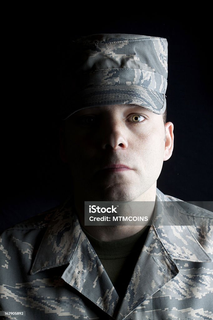 Air Force Airman Dramatically lit man in Air Force ACUs. Adult Stock Photo