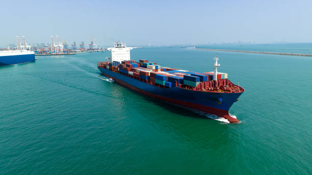 istock container cargo ship import export global business and industry commercial trade logistic and transportation of international by container cargo ship in the open sea, Container cargo freight shipping, front view drone shot, 1629061329