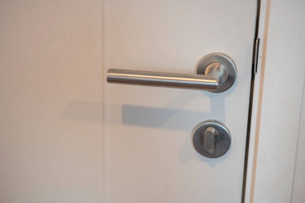 istock Door handle with white wooden door 1629067535