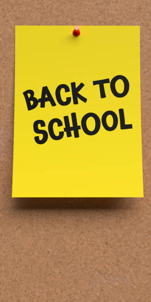 istock Back to school written on yellow paper note 1629067540