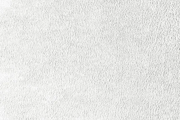 Terry cloth, white towel texture background. Soft fluffy textile bath or beach towel material. Top view, close up.