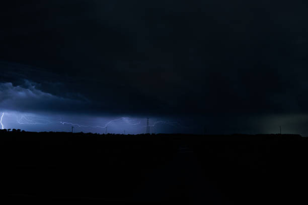 istock lightnings striking in the dark cloudy sky during a violent storm above the countryside 1629089879