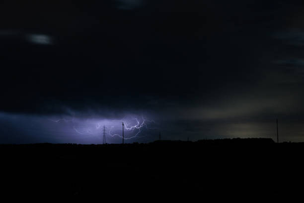 istock lightnings striking in the dark cloudy sky during a violent storm above the countryside 1629089890
