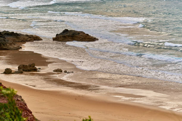 Rocky beach with swell, cloudy day, view at altitude