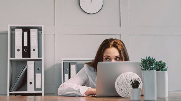Hiding freelancer laptop hiding lazy woman scared