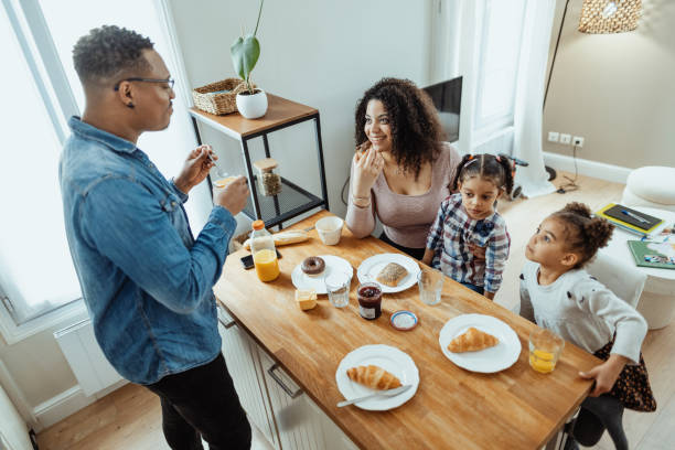 istock Family enjoying breakfast on weekend at home 1629111482