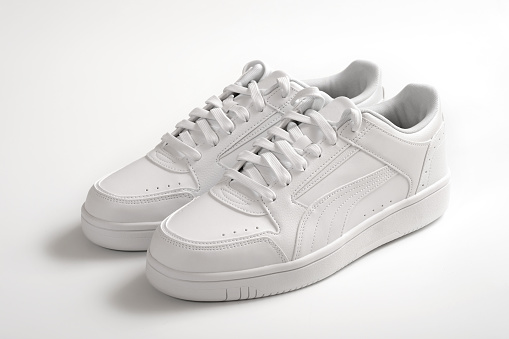 Close-up of white sports shoes on a white background. Active lifestyle