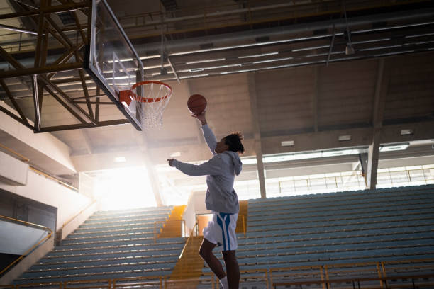 istock Man throwing basketball towards basket 1629131201