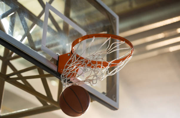 istock Close-up of basketball falling from basket 1629131215