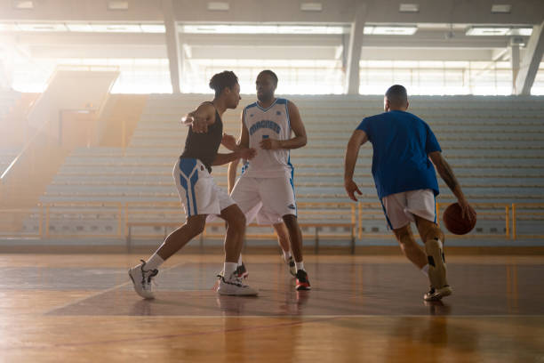 istock Basketball players playing on court 1629131216