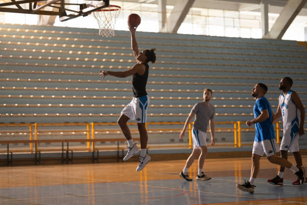 istock Basketball players playing on court 1629131229