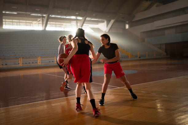 istock Basketball players playing on court 1629131240