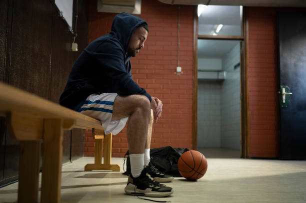 istock Young man looking at basketball 1629131244