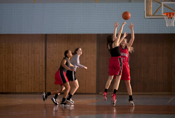 istock Basketball players playing on court 1629131250