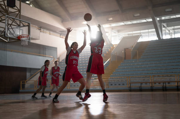 istock Basketball players playing on court 1629131262