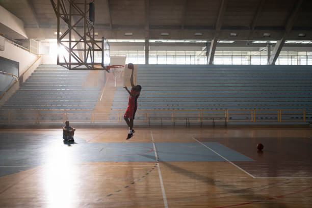 istock Basketball player dunking basketball 1629131265