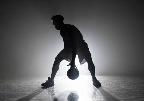 istock Young man dribbling basketball during practice 1629131272