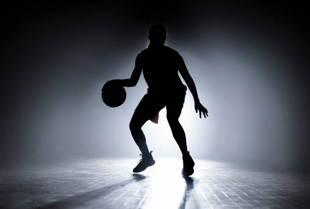 istock Woman dribbling on court 1629131276