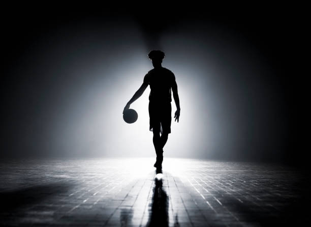 istock Young man dribbling on court 1629131650