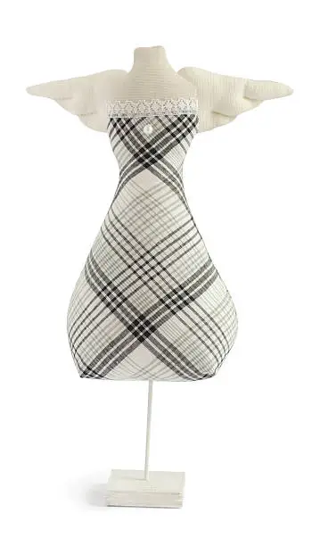 handmade Tilda doll mannequin in black and white dress isolated on white background