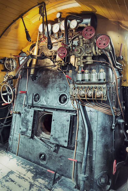 vintage engine room of a steam train Controls in the cabin of a vintage steam train locomotive firebox steam engine part stock pictures, royalty-free photos & images