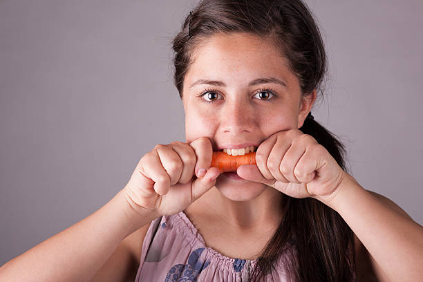 istock Girl with carrot 162915096