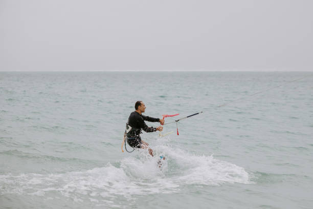 istock Man enjoying his kite surfing session at the beach 1629157840