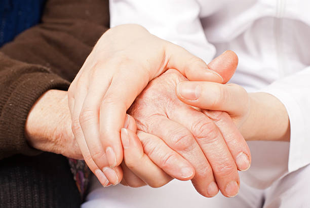 istock Young doctor holds the elderly woman hands 162916450