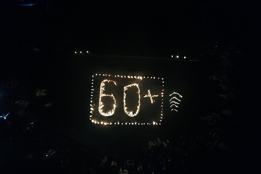 candles that make up the number 60, representing 60 minutes of Earth Hour, during Earth Hour in Banda Aceh, Indonesia