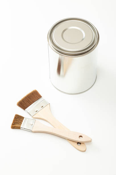 istock Paint brushes and paint cans on white background. 1629169880