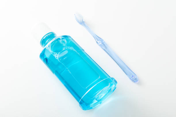 istock Toothbrush and mouthwash on white background. 1629172208