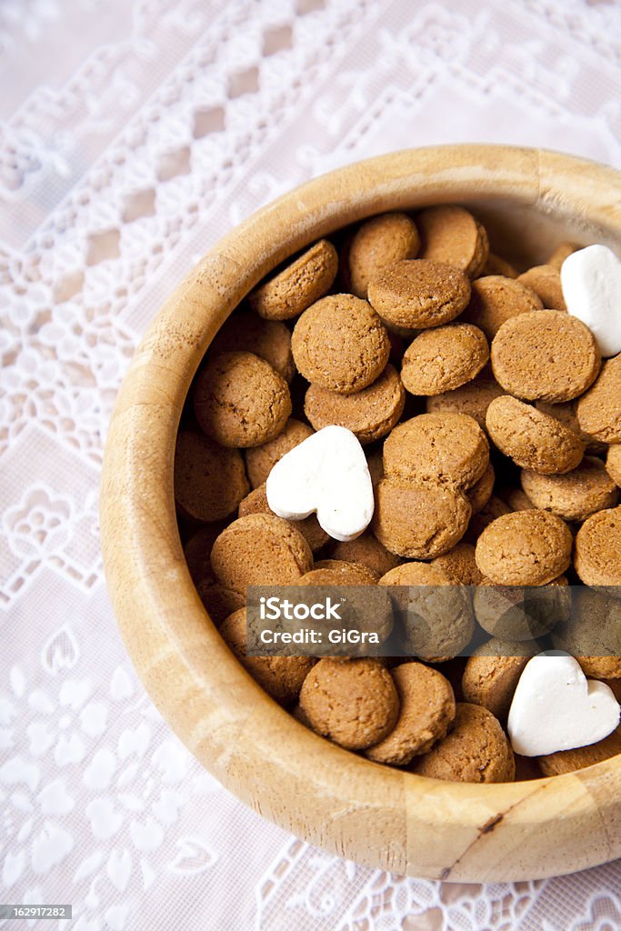 Dutch candy pepernoten in scale on table Baked Stock Photo