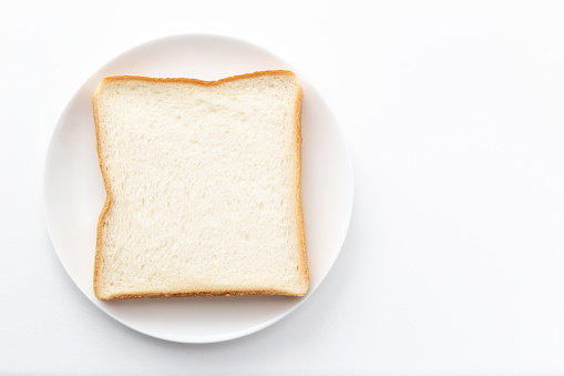 Bread on a white background (overhead view)