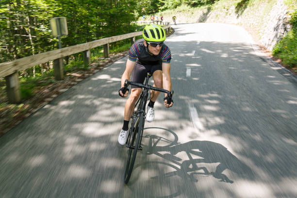 istock Bicycle rider in front of his friends 1629176751