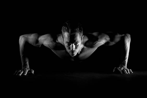 istock Black and white photo of man doing pushups 162919431