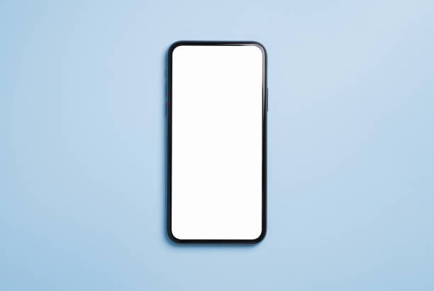 istock Top view of black smartphone with blank screen on blue background. 1629194714