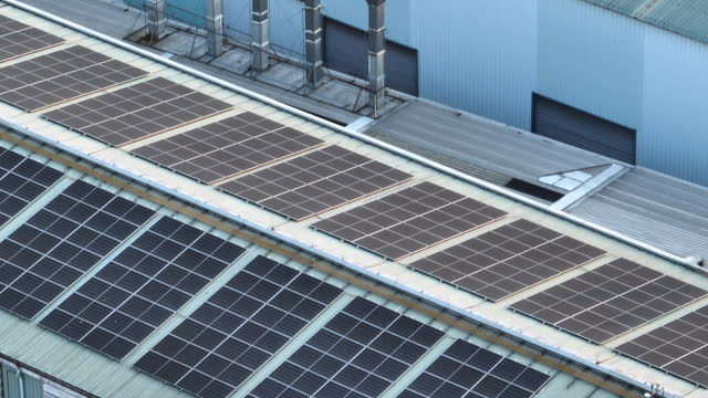 Aerial view of solar panel on factory roof top