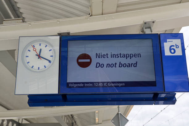 Sign Do Not Board (niet instappen) on the platform on station Zwolle Sign Do Not Board (niet instappen) on the platform on station Zwolle netherlands instappen stock pictures, royalty-free photos & images