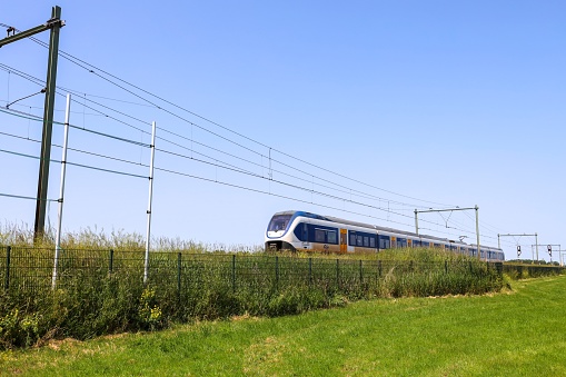 SLT local commuter train on dike at Moordrecht in the Netherlands
