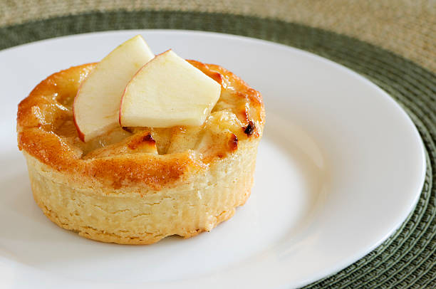 A fresh baked homemade apple pie on the old wooden table