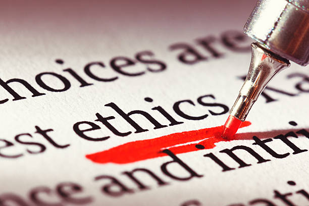 Ethics is underscored heavily in a document: morality has relevance! A highlighter underlines the word 'ethics' heavily in a business document or textbook. Morality IS important. morality stock pictures, royalty-free photos & images