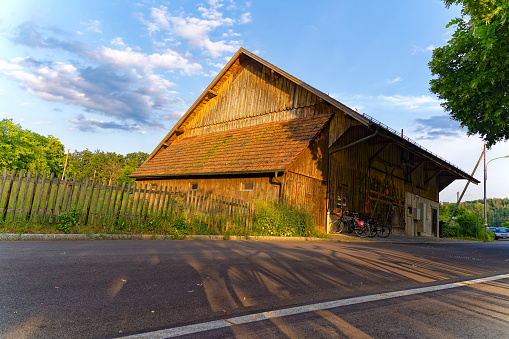 Scenic view of wooden barn at Swiss City of Zürich on a sunny spring evening. Photo taken June 3rd, 2023, Zurich, Switzerland.