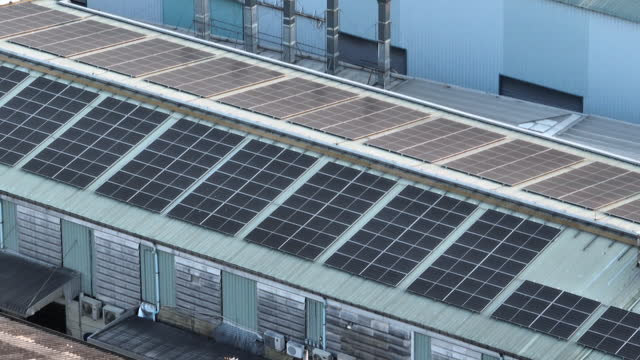 Aerial view of solar panel on factory roof top