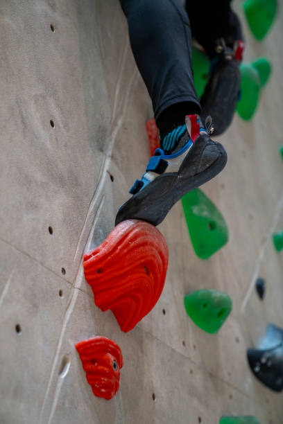 istock Woman climbing on the climbing wall 1629246913