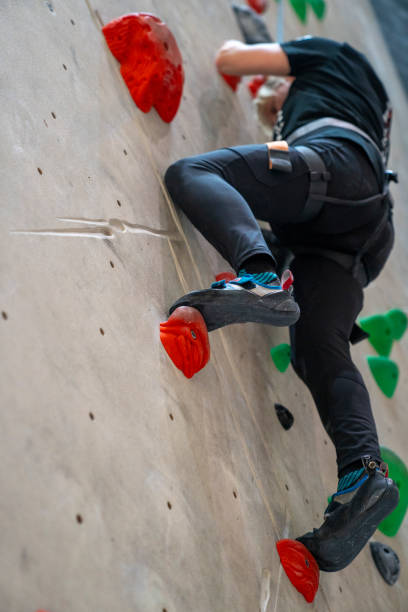 istock Woman climbing on the climbing wall 1629246987