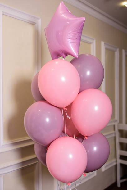 istock Bunch of pink party balloons 1629249813