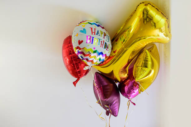 istock Number 1 one and colour balloons on the ceiling 1629258163