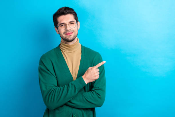 istock Portrait of successful elegant corporate man indicate finger empty space ad isolated on blue color background 1629259766
