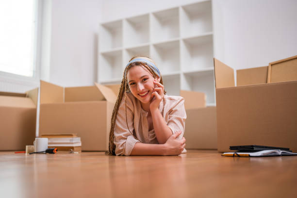istock Happy ginger woman moving into new home 1629265344